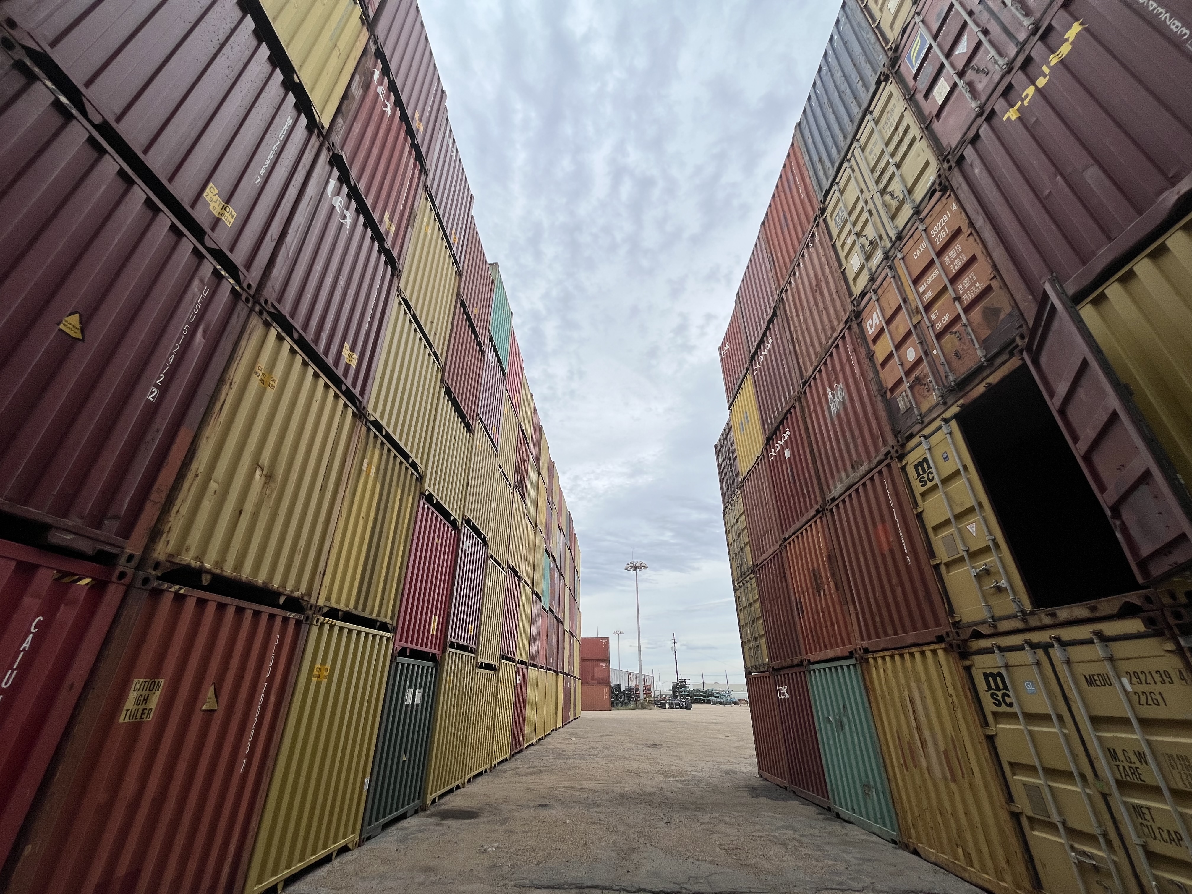 Company truck and shipping containers at our yard